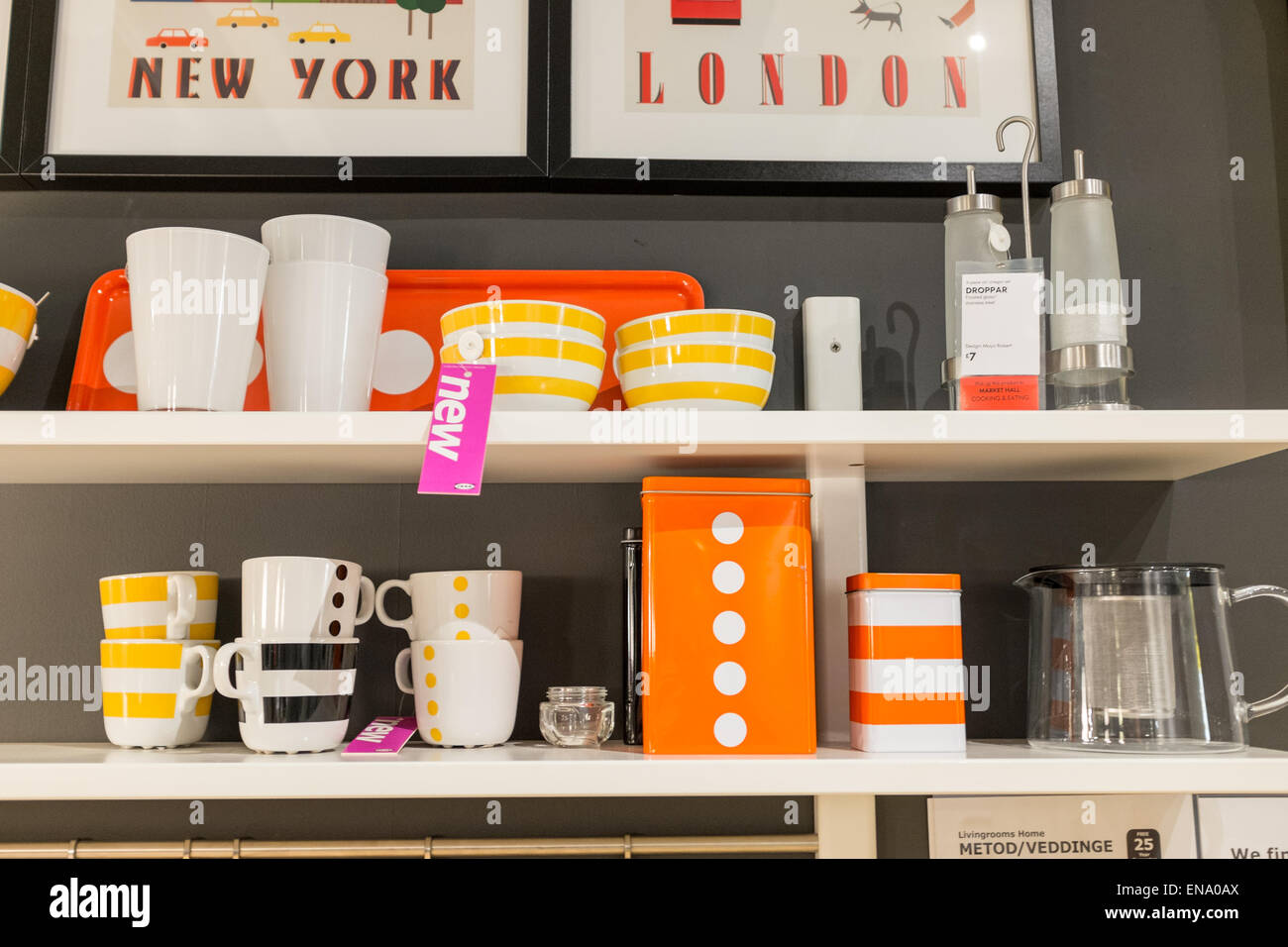 Shelf display at Ikea with cups,mugs, and storage containers Stock