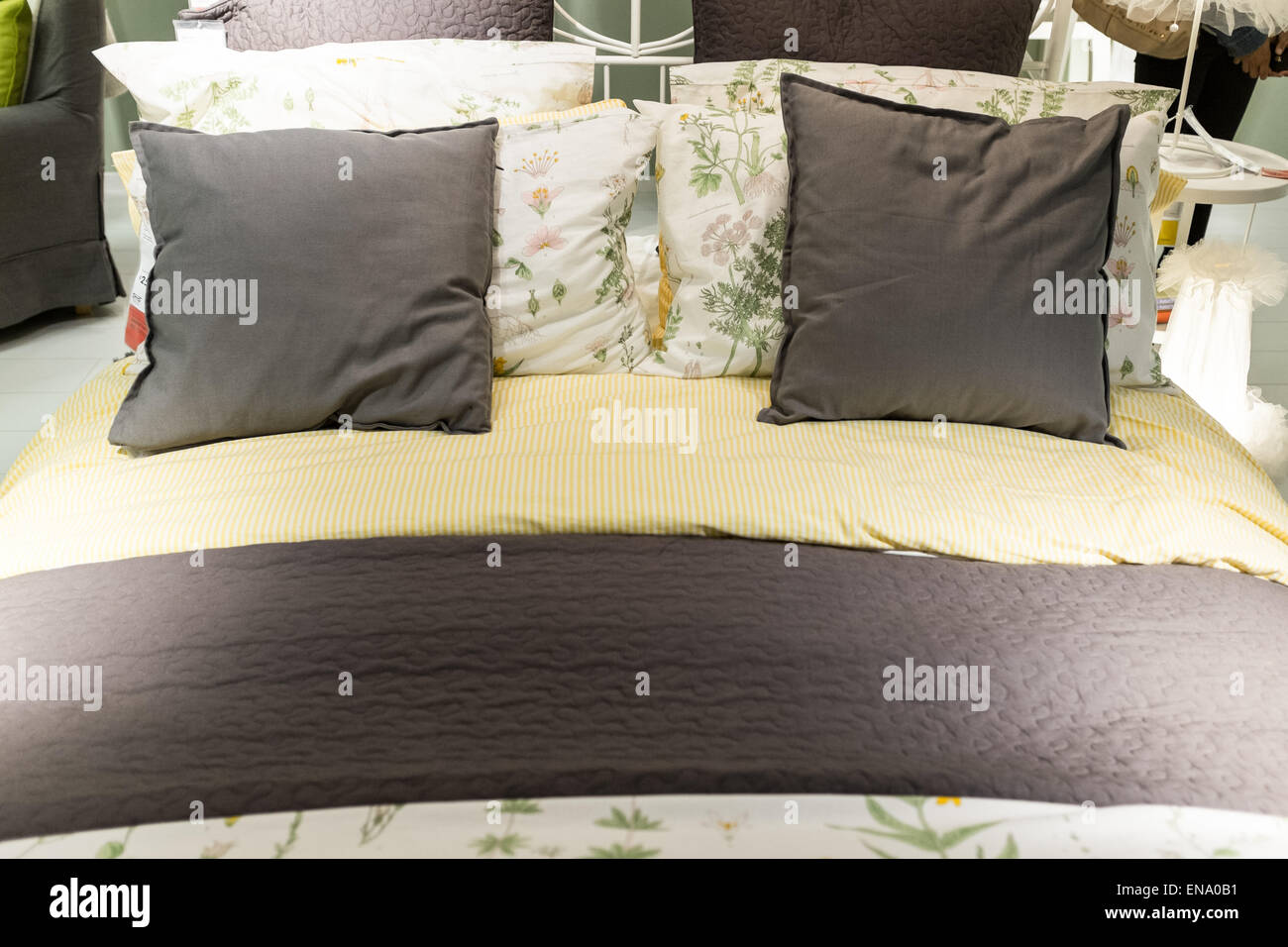 Bed display at ikea with pillows bedspread and duvet Stock Photo