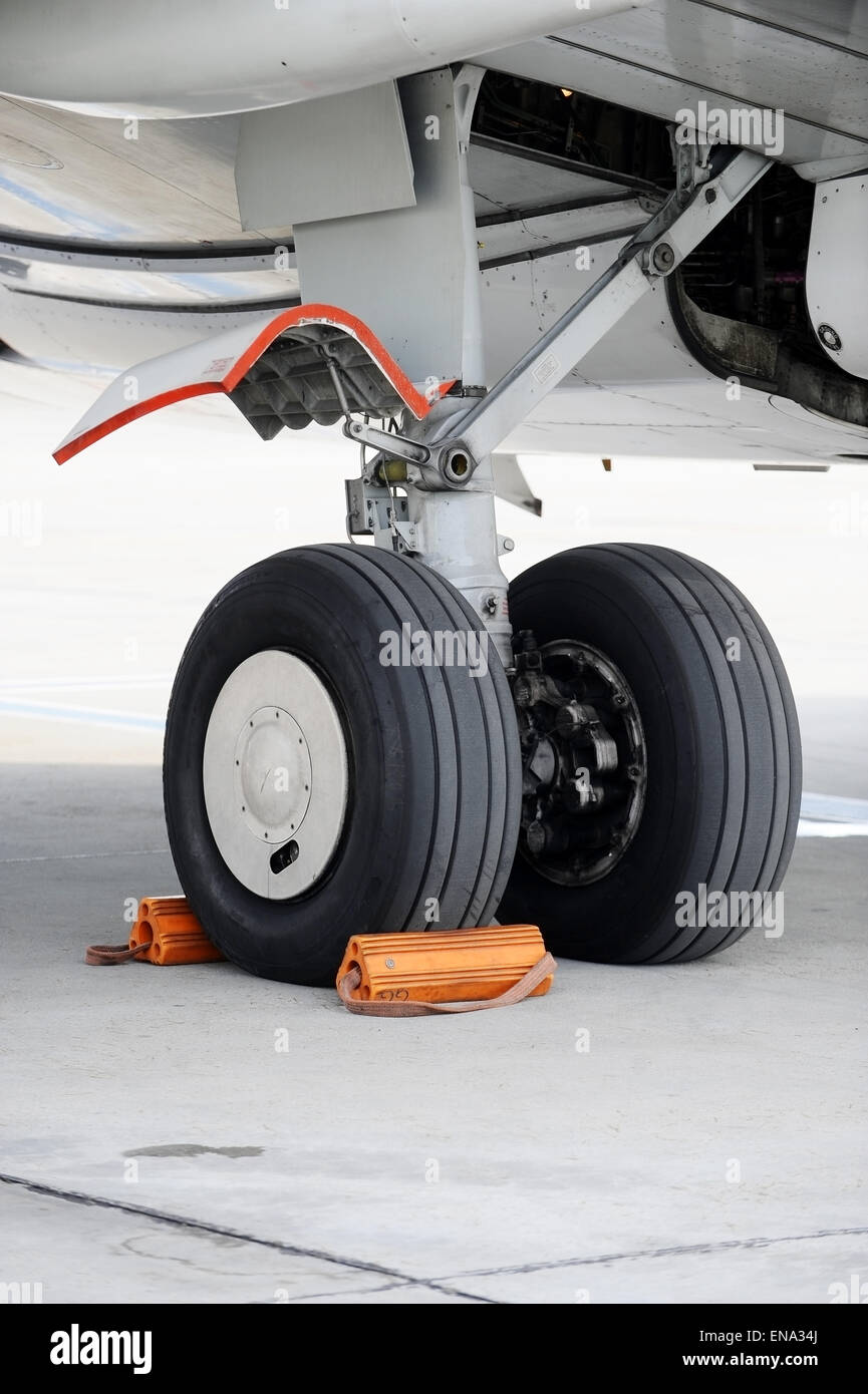 Detail shot with big airplane wheels and landing gear Stock Photo
