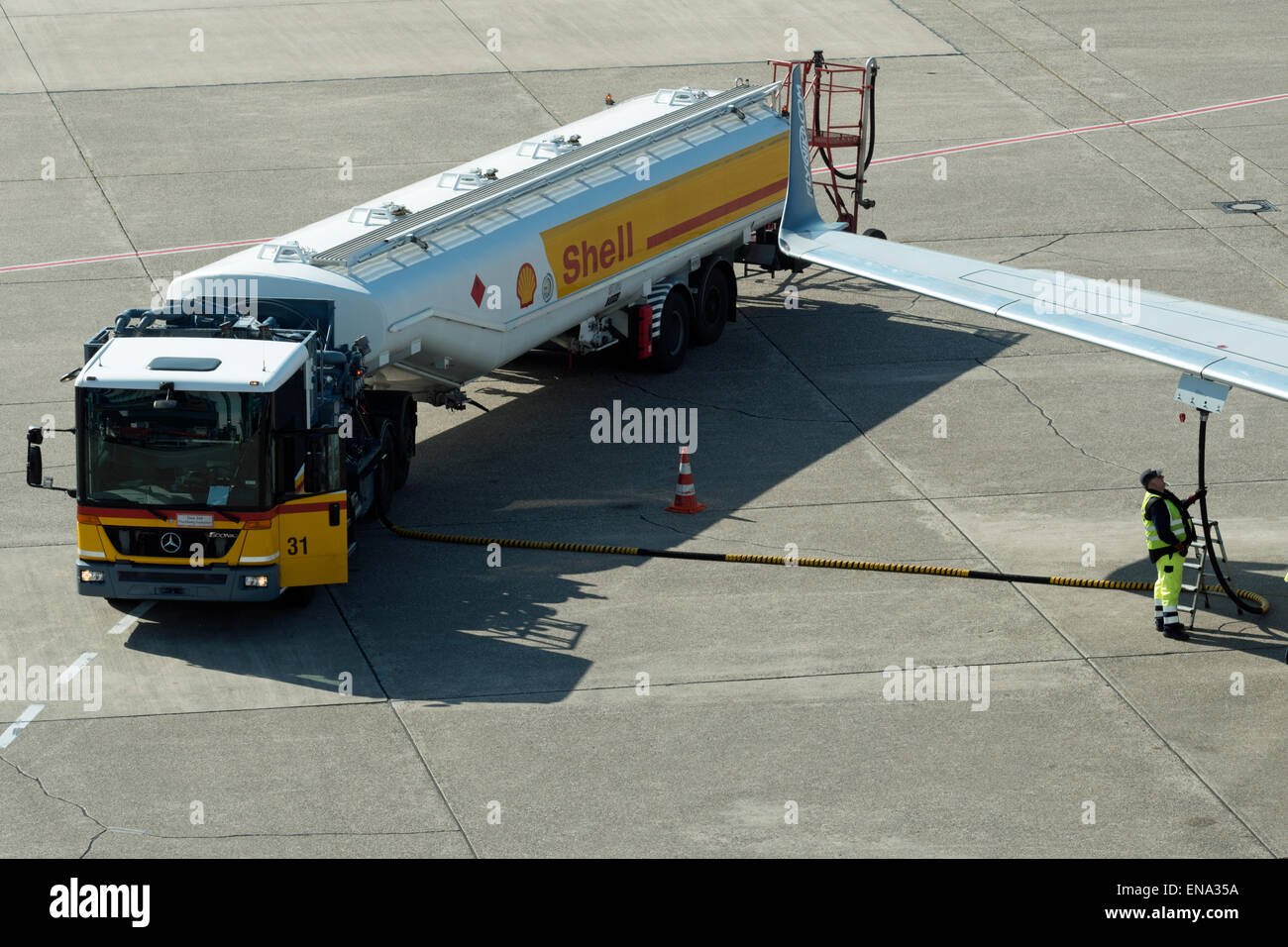 Shell aviation fuel tanker refuelling aircraft at Dusseldorf airport Germany Stock Photo