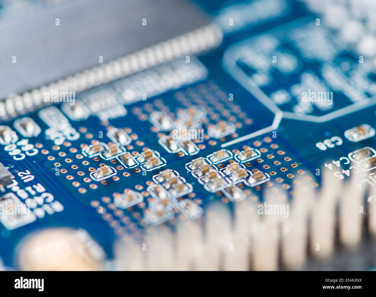 Blue PCB with SMD components (detailed close-up shot) Stock Photo