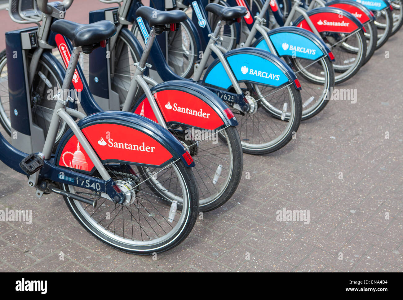 Cycle hire docking station with new bikes sponsored by Santander who are replacing Barclays as main sponsor. Stock Photo