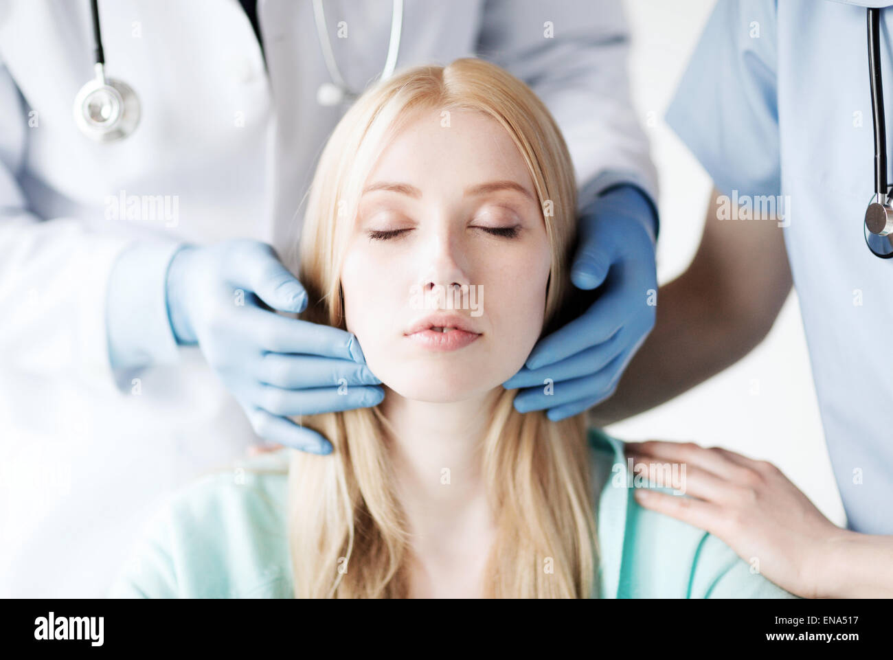 plastic surgeon or doctor with patient Stock Photo