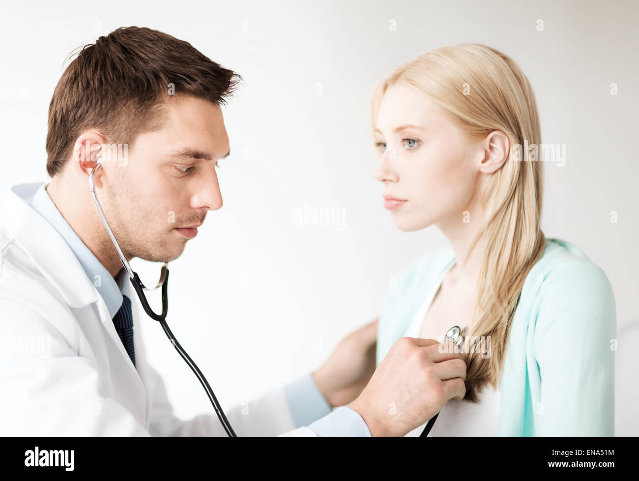 doctor with stethoscope listening to the patient Stock Photo - Alamy