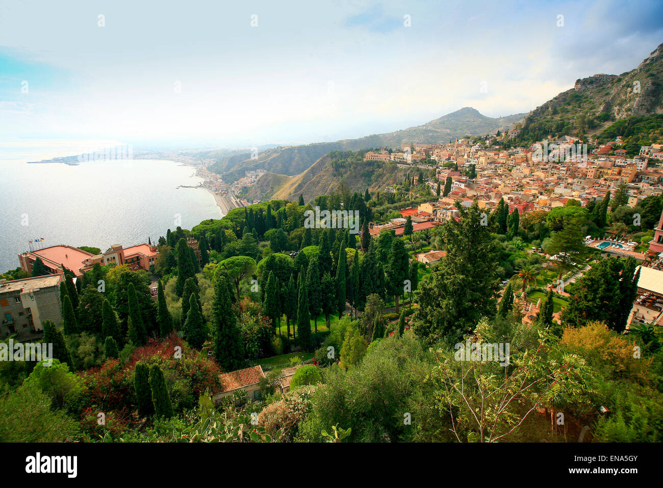View over Taormina in Sicily with the Mediterranean and Sicilian coastline. Stock Photo