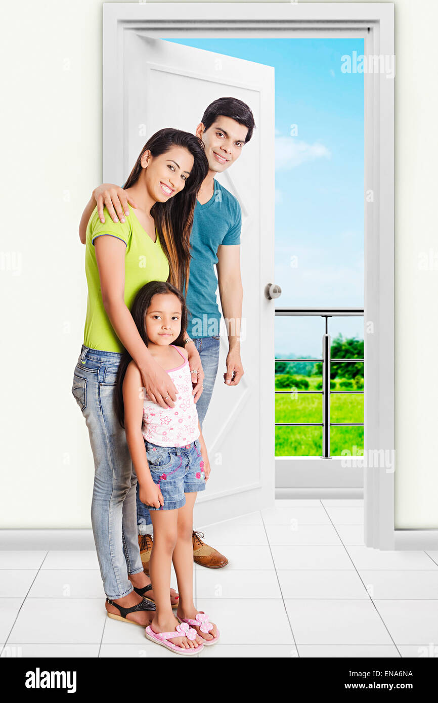 Happy Indian Family In Front Of House