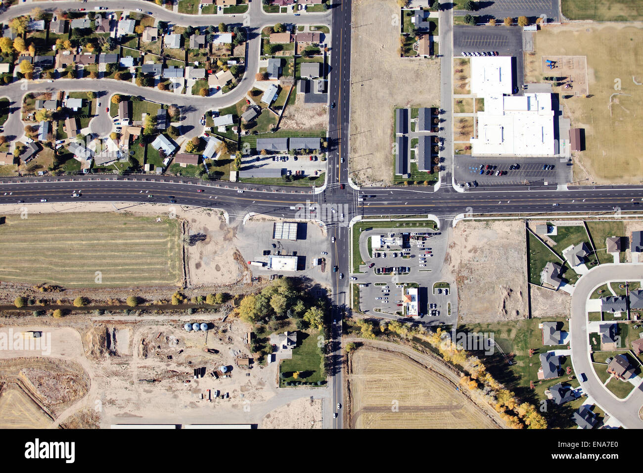 An aerial view of an eight lane intersection in a mid mid-sized city. Stock Photo