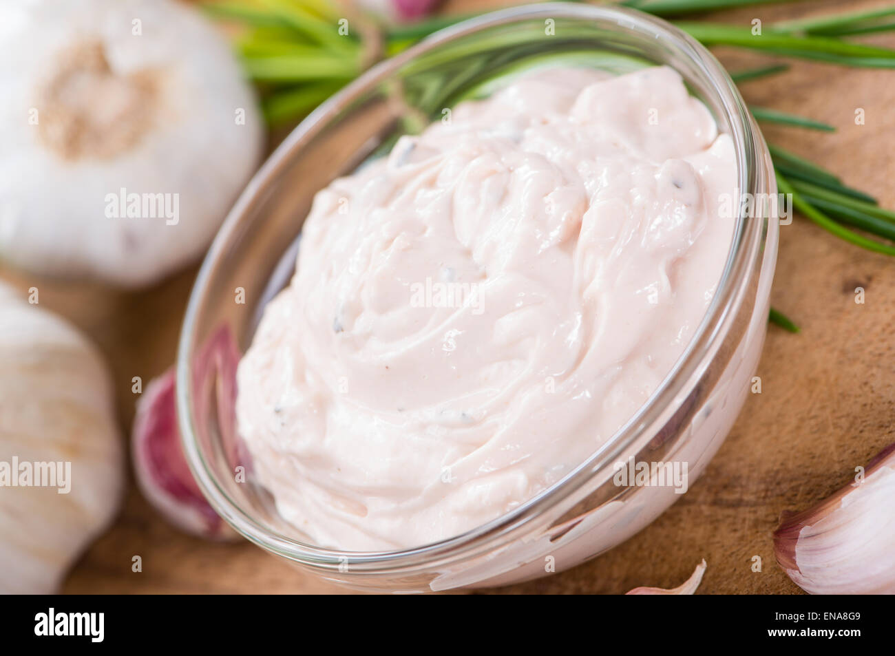 Garlic Dip (Aioli) with ingredients on wooden background Stock Photo