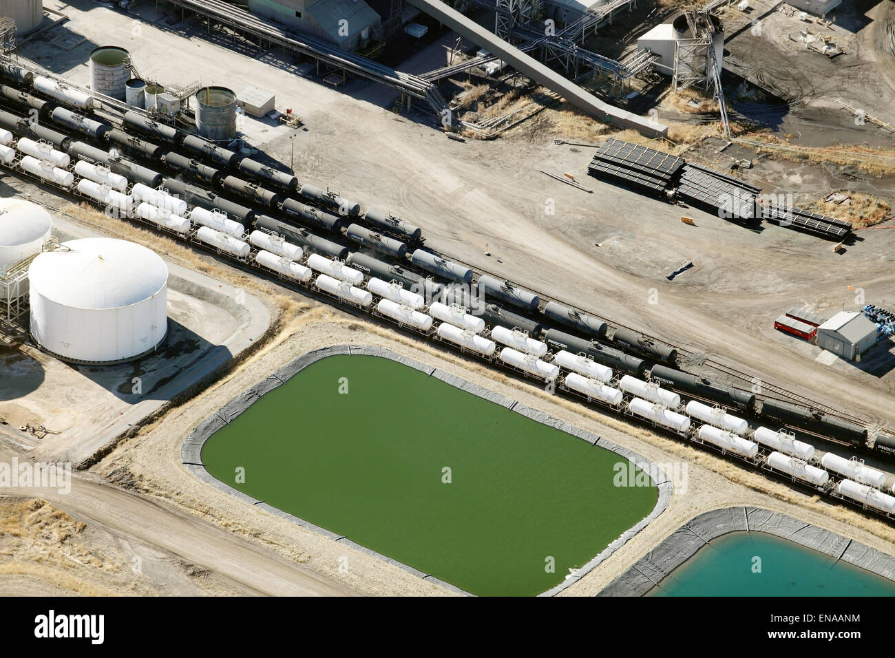 An aerial view of the water treatment facility at a phosphate mine, with railroad sidings and rail cars. Stock Photo