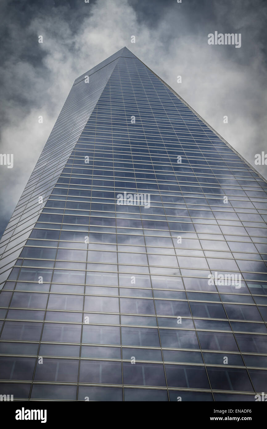 skyscraper with glass facade and clouds reflected in windows Stock ...