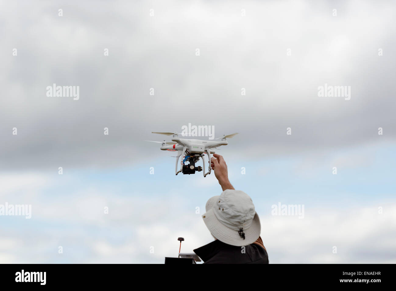 Small consumer drone flying (DJI Innovations Phantom 2) Stock Photo
