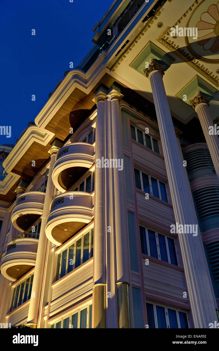 Apartments lit at night and viewed from below. Stock Photo