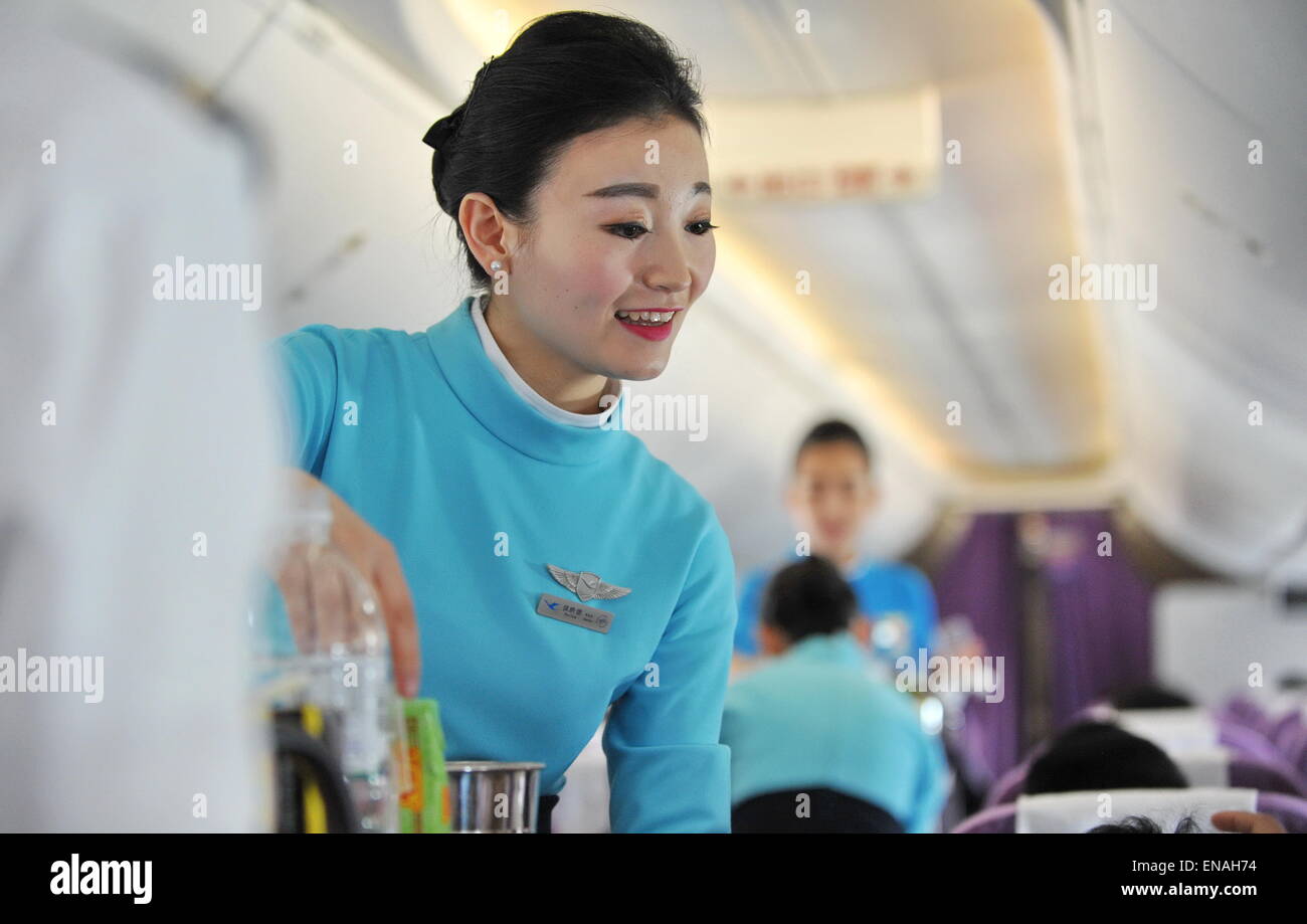 Xiamen. 30th Apr, 2015. Stewardesses of Xiamen Airlines work in the cabin of a passenger Xiamen. 30th Apr, 2015. Stewardesses of Xiamen Airlines work in the cabin of a passenger