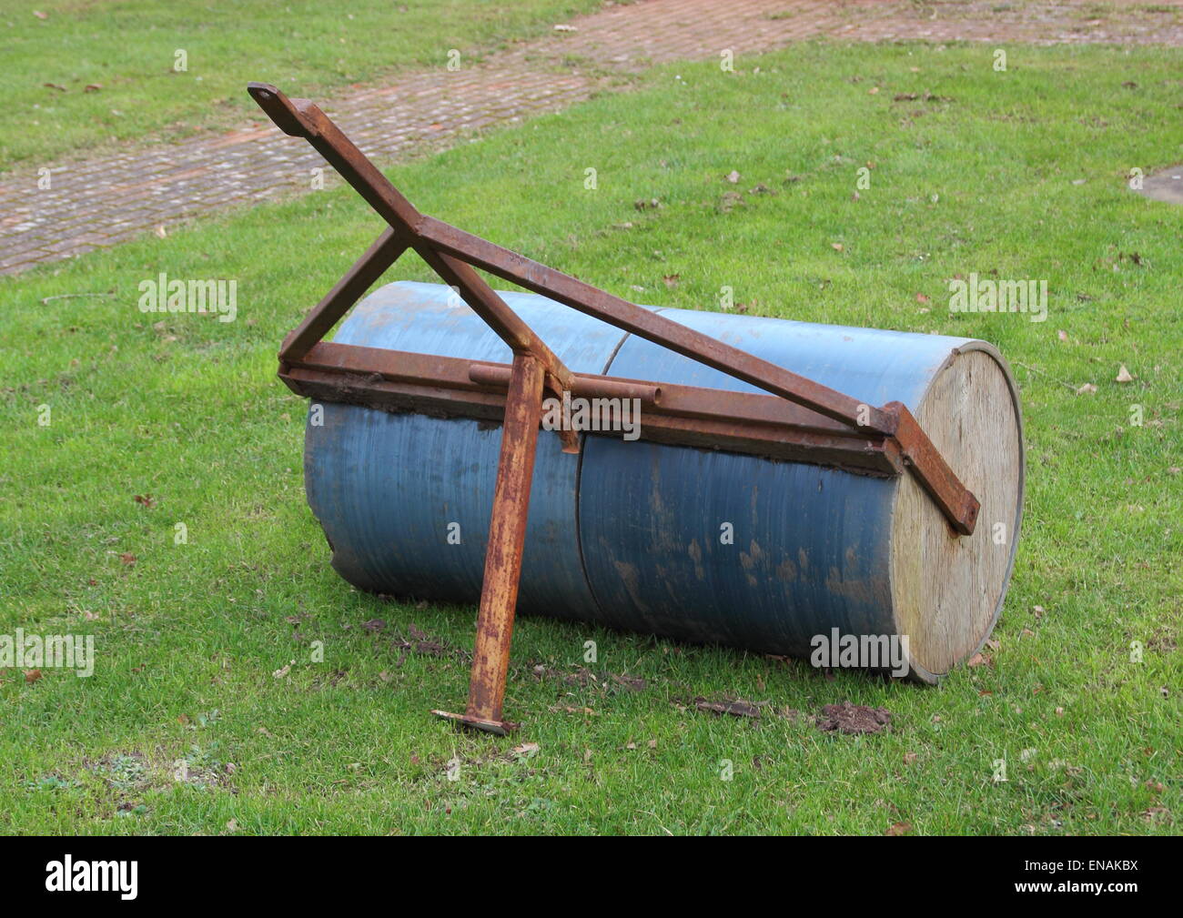 Heavy gardening lawn roller with rusty pull Stock Photo Alamy