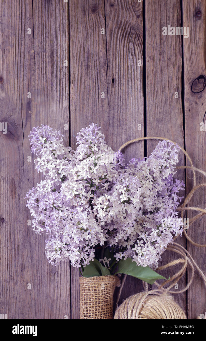 branches of blooming lilacs on an old wooden background Stock Photo - Alamy