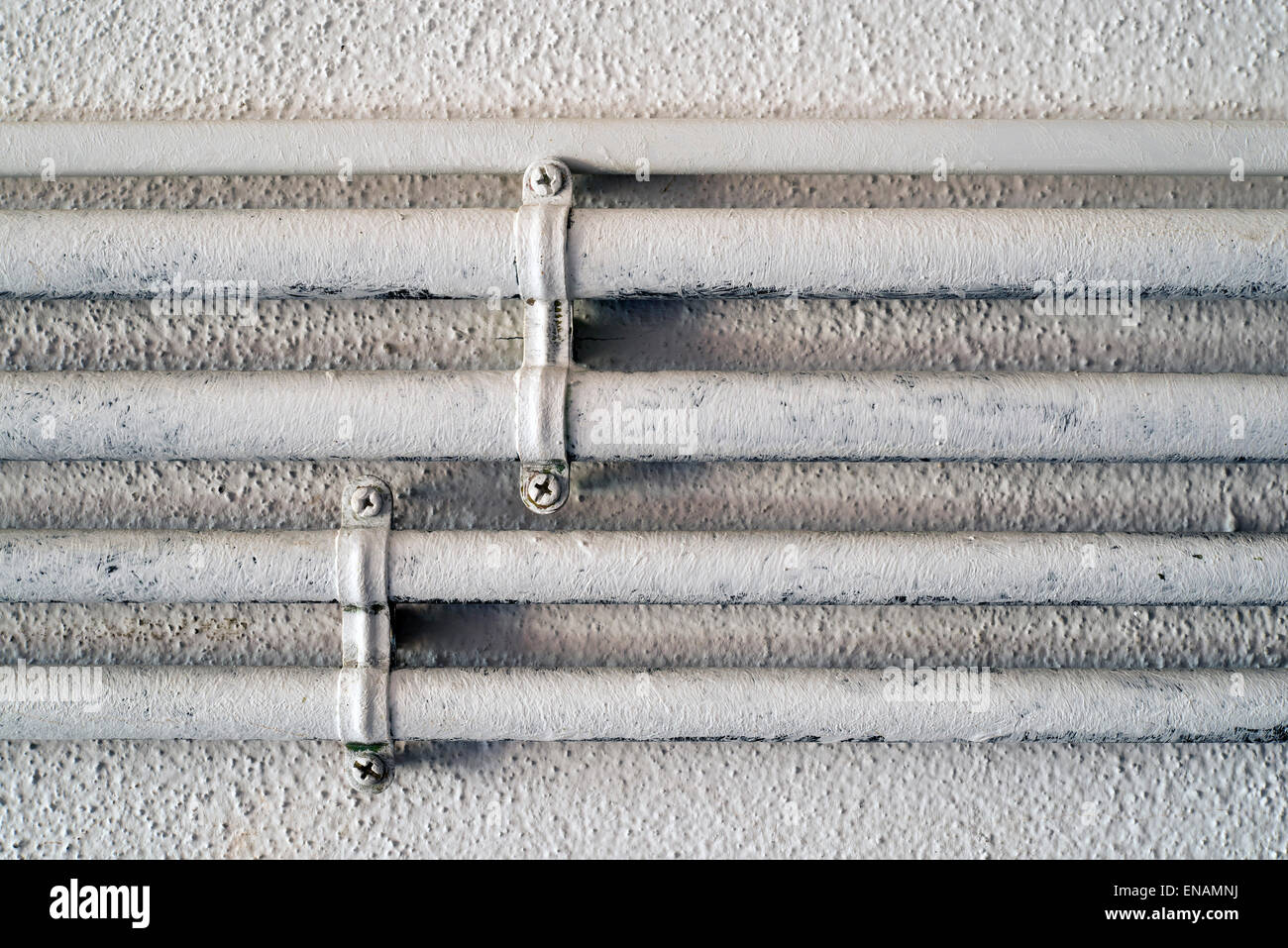 gas pipes painted white Stock Photo Alamy