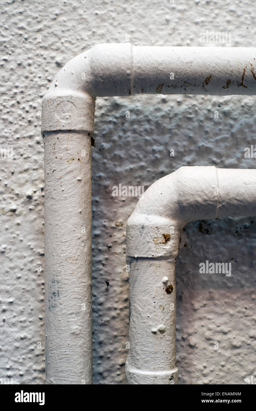 gas pipes painted white Stock Photo Alamy