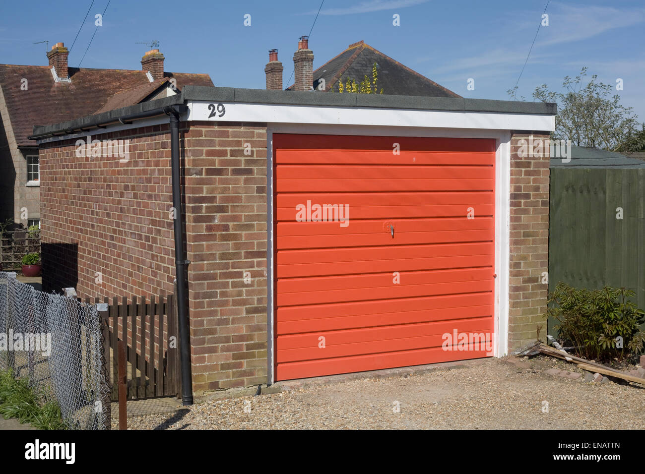 Single orange garage in Emsworth town centre Stock Photo