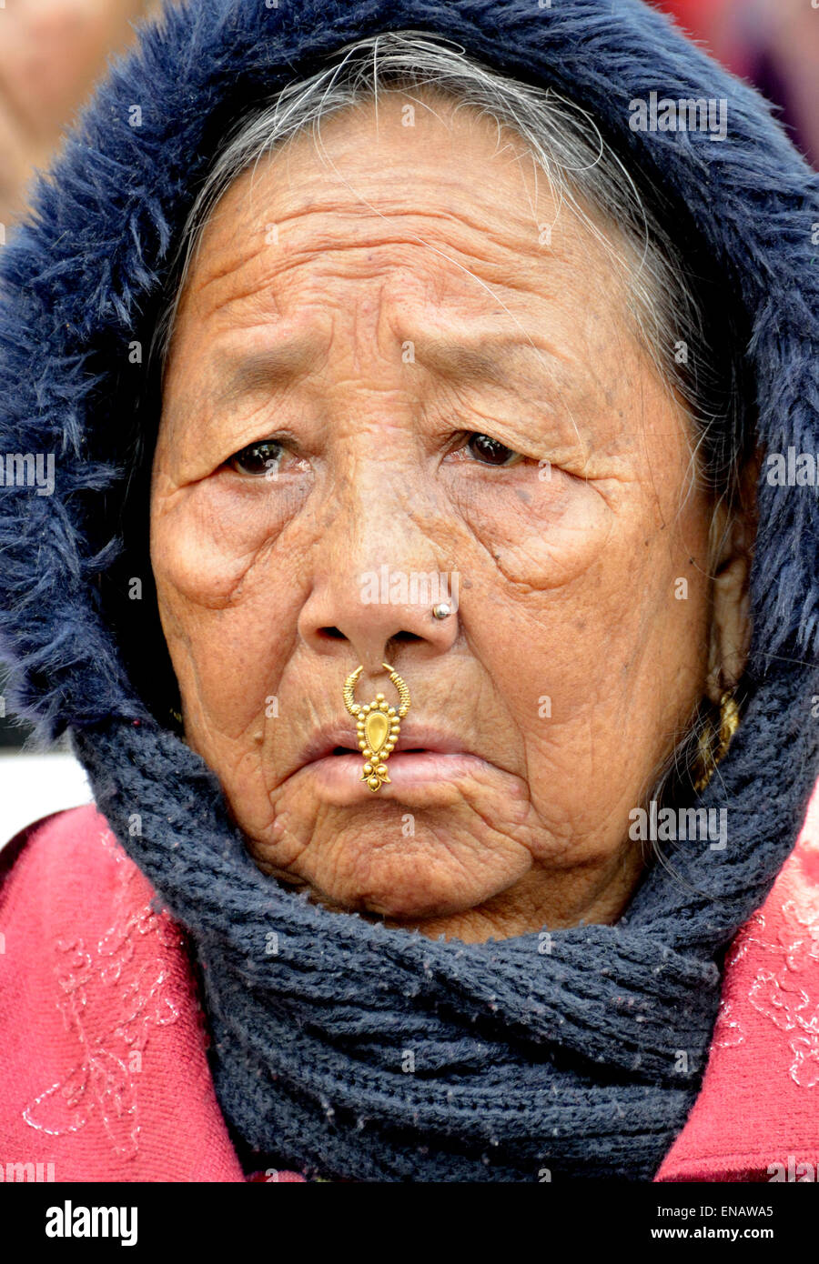 London, England, UK. Elderly Nepalese woman wearing a nose stud (phuli) and hanging nose ornament (bulaki) Stock Photo