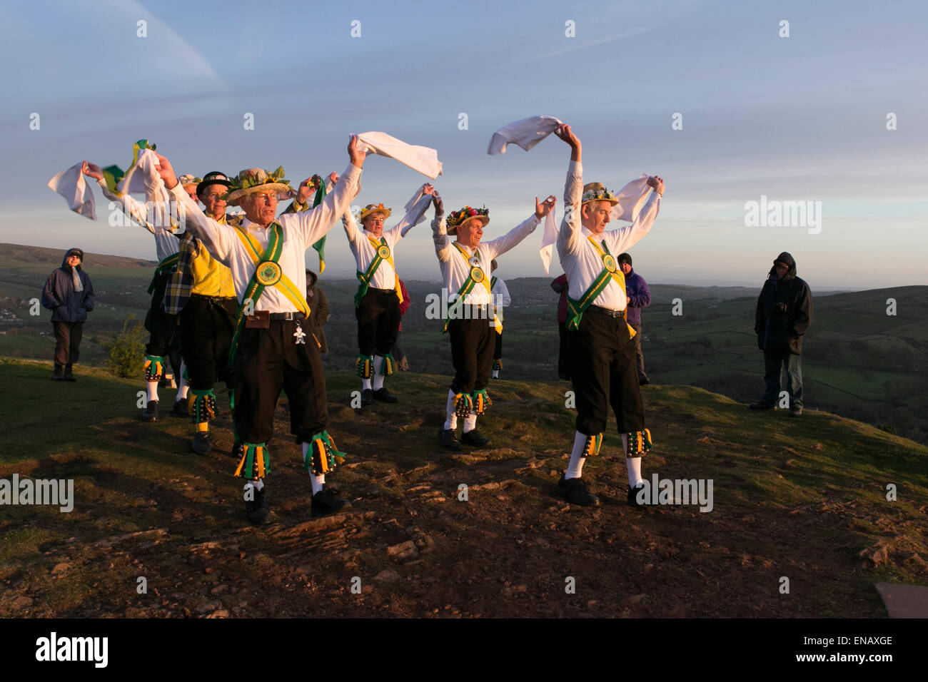 Morris dancers from the ChapelenleFrith Morris Men dance at sunrise