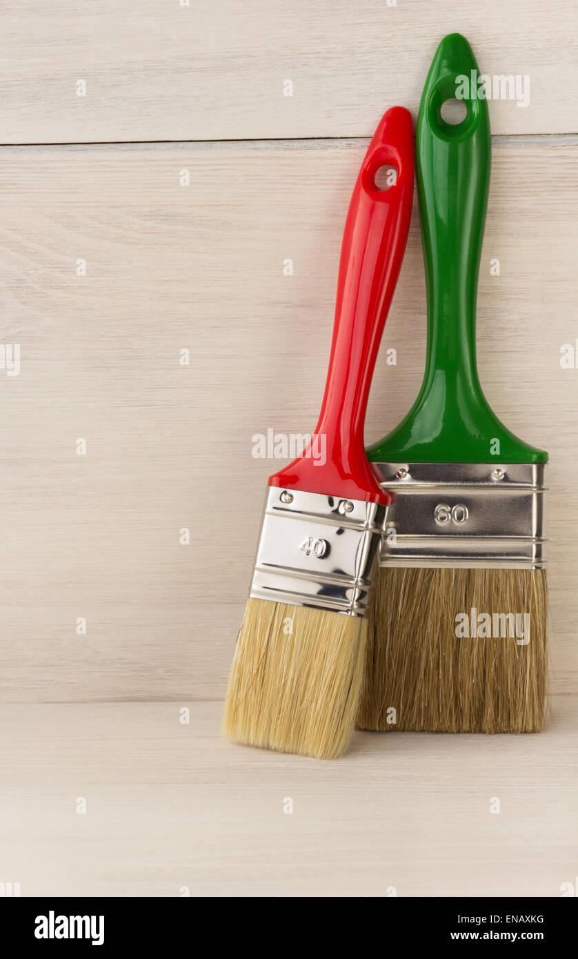 paint brush on wooden background Stock Photo - Alamy