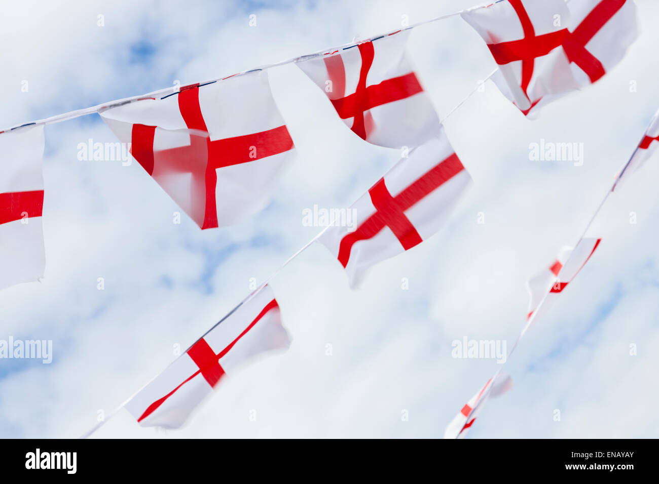 Bunting made from English flags blowing in the wind and viewed from below. Walsall, England, UK Stock Photo