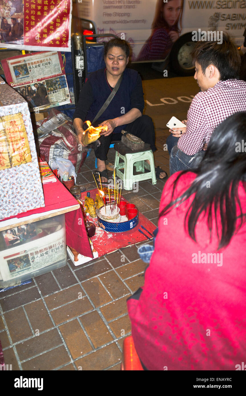 dh Fortuneteller CAUSEWAY BAY HONG KONG Chinese fortune teller woman burning paper foretelling mans future telling Stock Photo