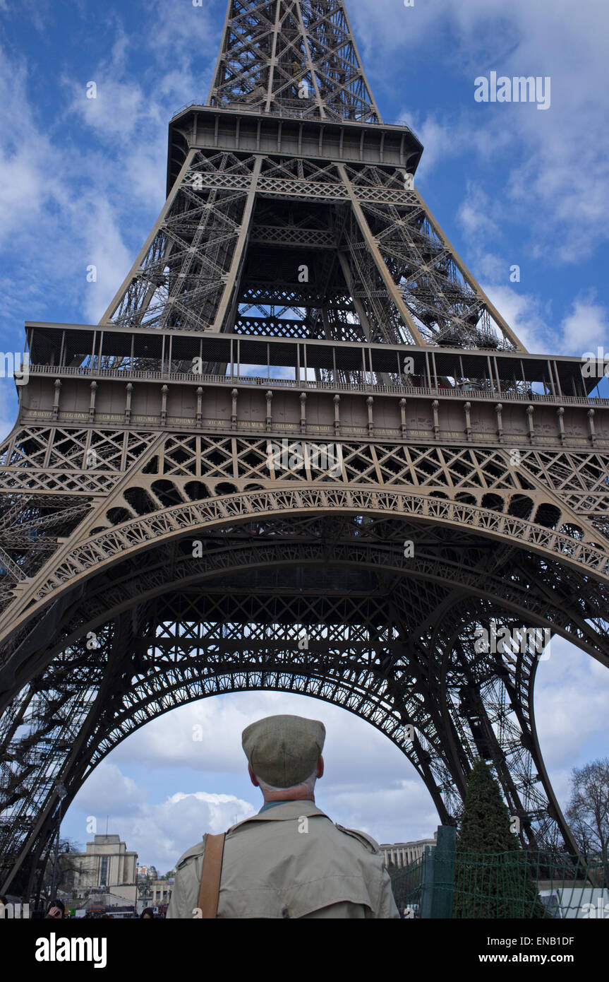 A mature male tourist looks at the Eiffel Tower. Stock Photo