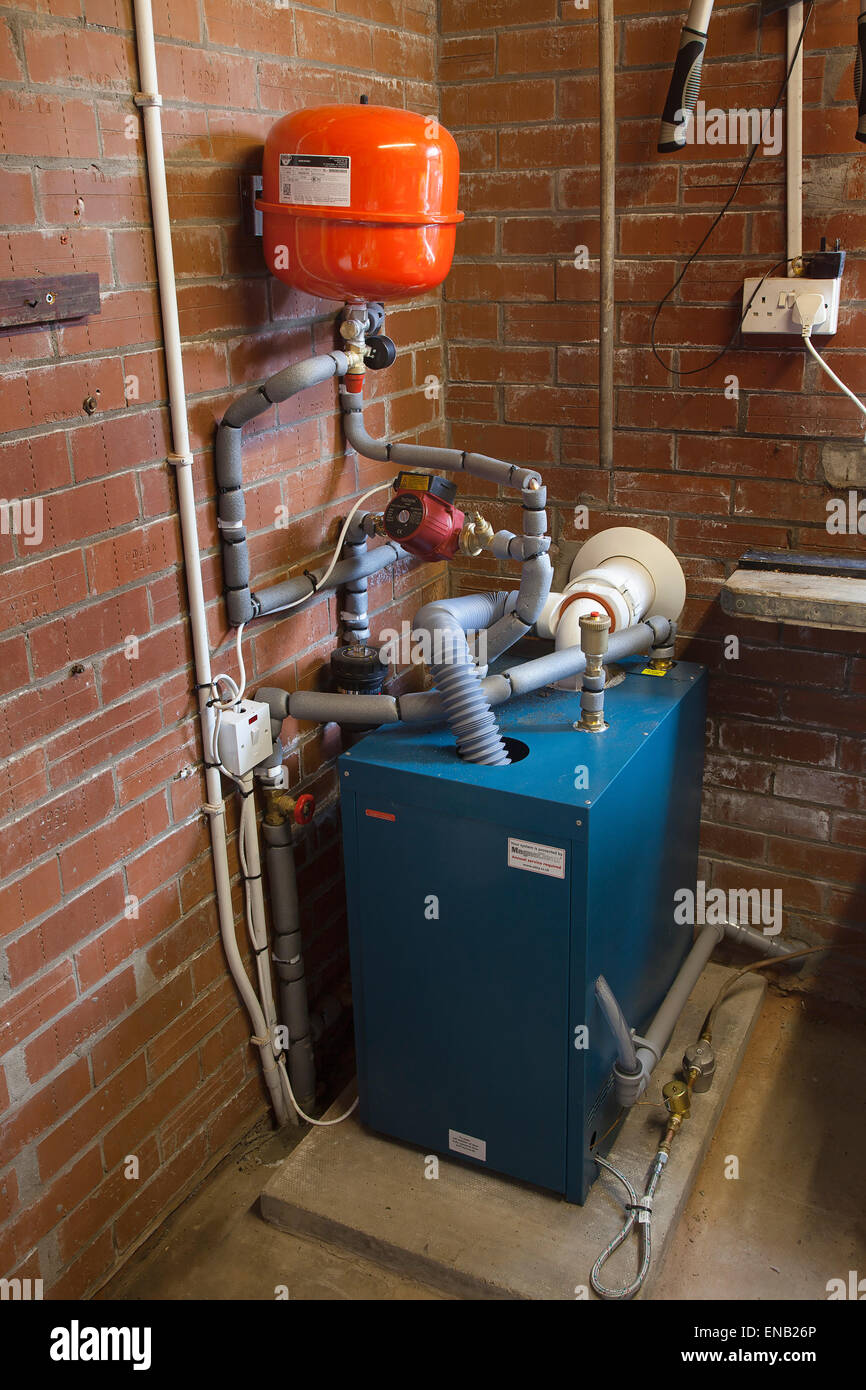 Housing, Homes, Oil fired central heating boiler situated in garage. Stock Photo
