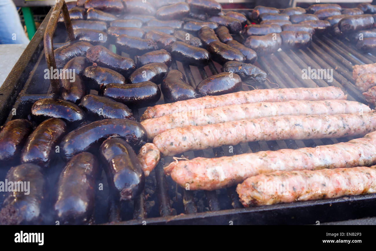 Argentinean Style Morcilla Black Sausage and chorizos on  bbq, barbecue meat, Charcoal grill, Spain. Stock Photo
