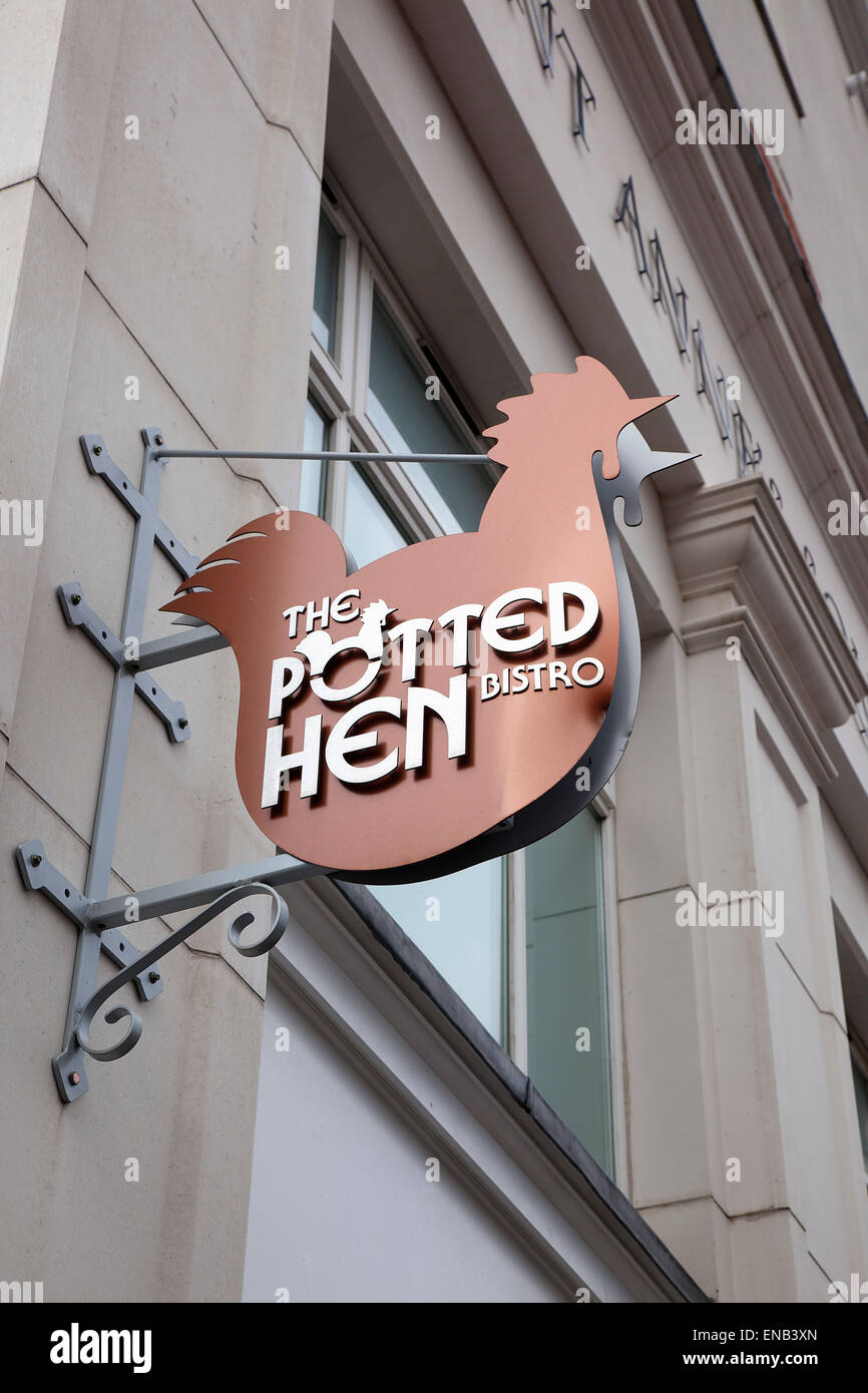Ireland, North, Belfast, Cathedral Quarter, Exterior sign for the Potted Hen restaurant in St Annes Square. Stock Photo