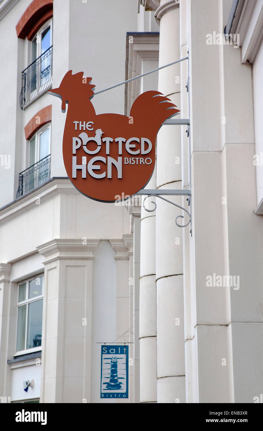 Ireland, North, Belfast, Cathedral Quarter, Exterior sign for the Potted Hen restaurant in St Annes Square. Stock Photo