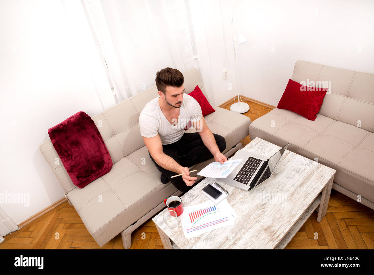 Businessman working at home in the laptop Stock Photo