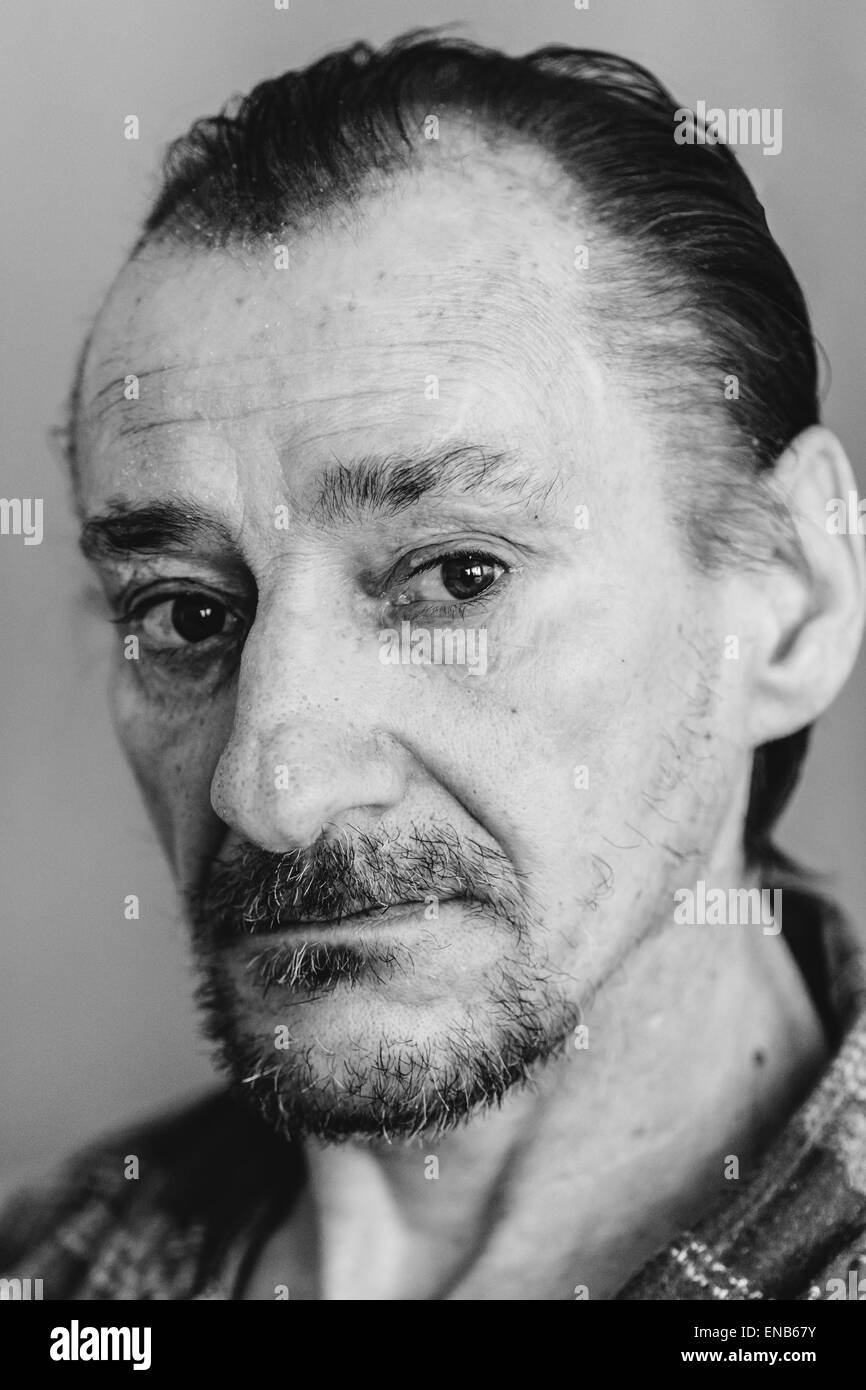 Portrait Of Serious Sad Old Adult Expressive Man With Beard Looking At Camera. Black And White, Monochrome Photo Stock Photo