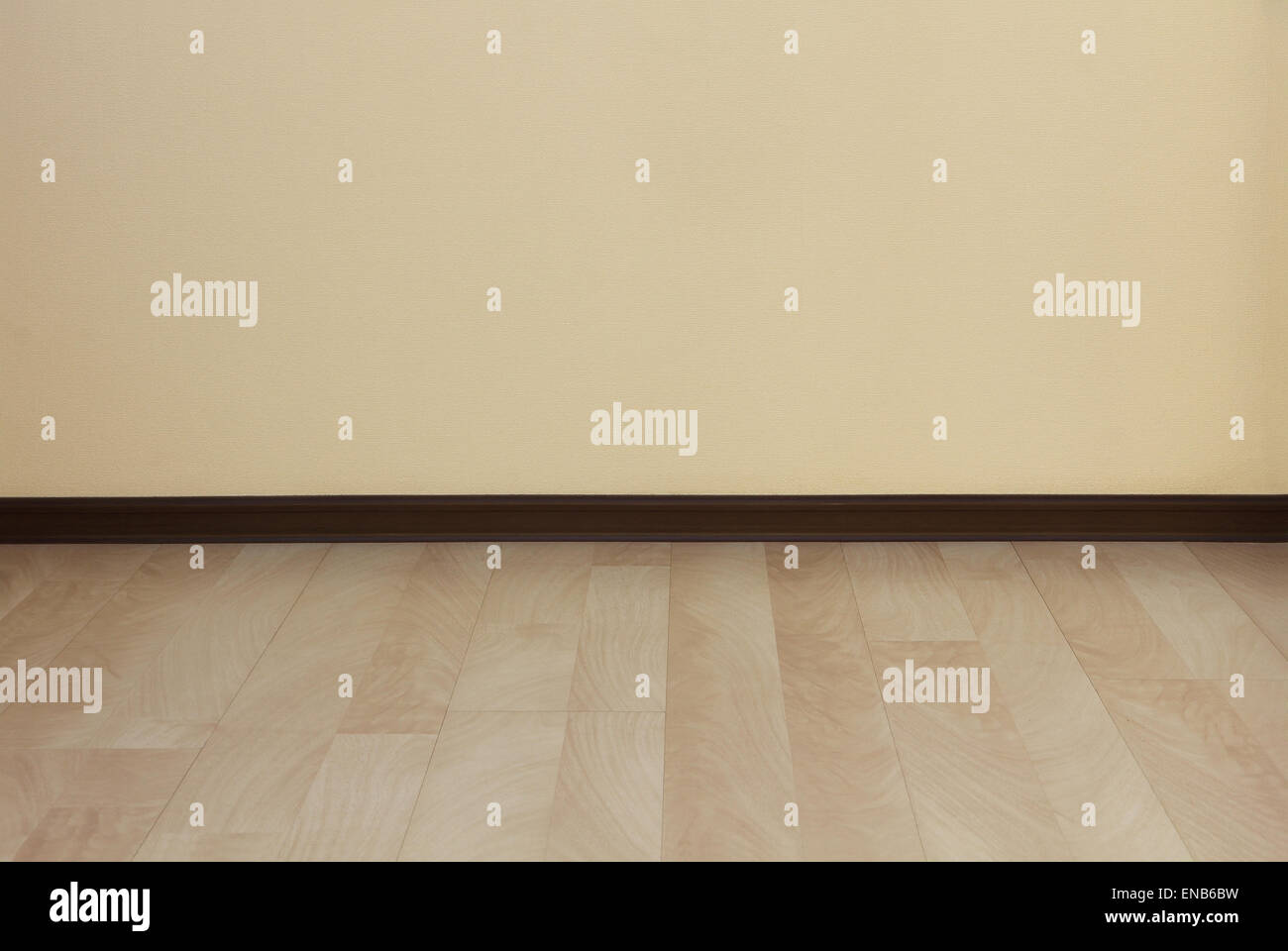 Clean wall and laminate floor as background. Stock Photo