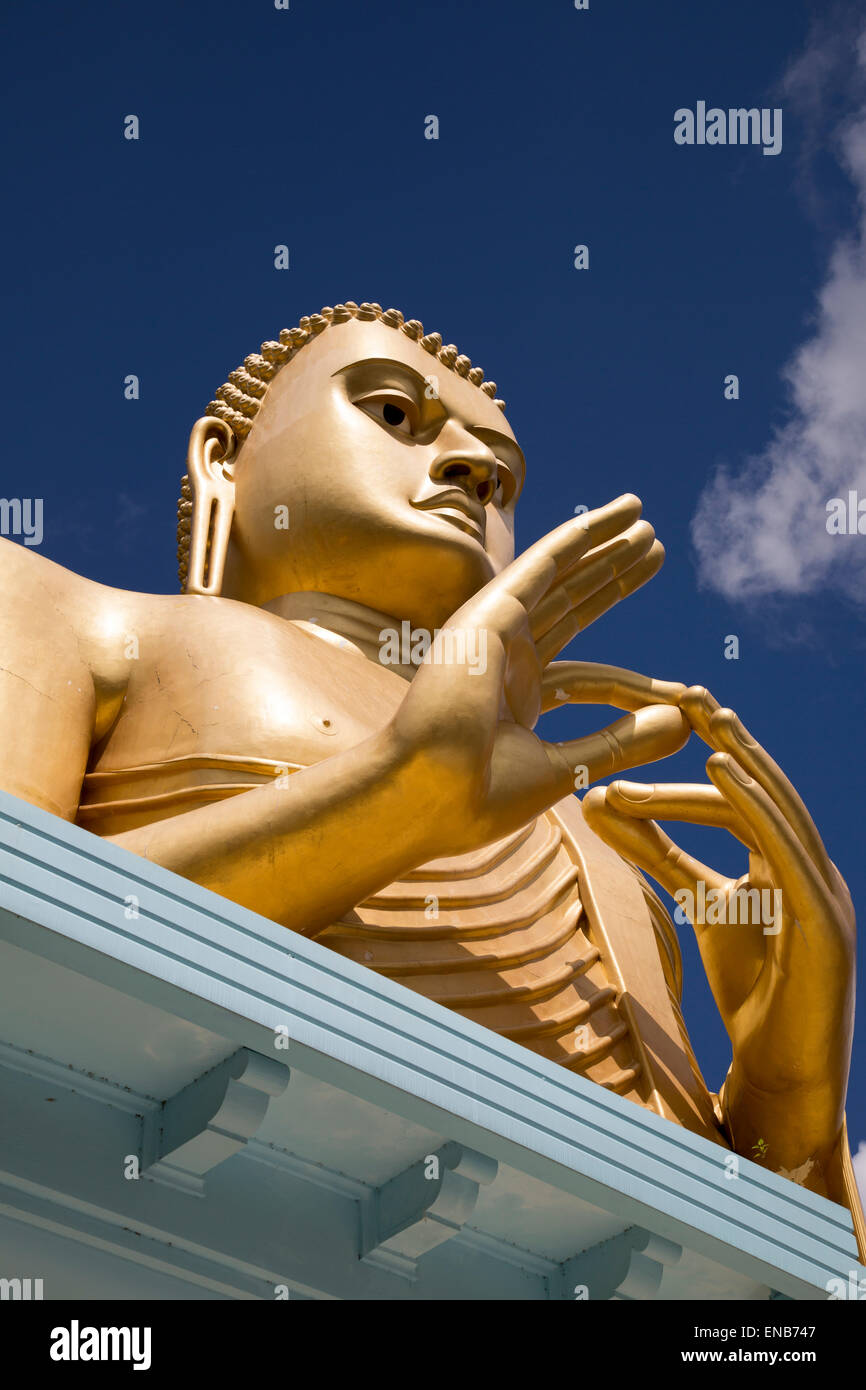 Giant golden buddha statue at dambulla cave temple complex hires stock