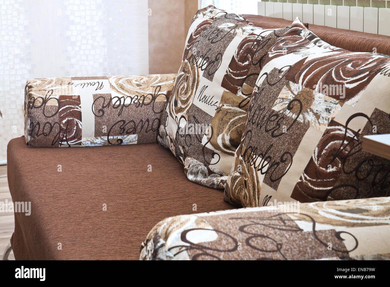 Detail from home sofa with pillows in beige brown tones Stock Photo
