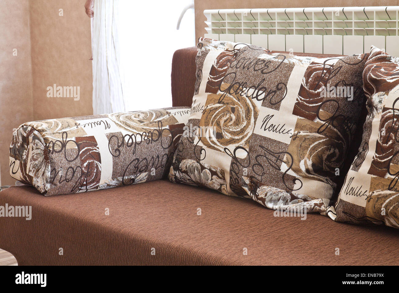 Detail from home sofa with pillows in beige brown tones Stock Photo - Alamy