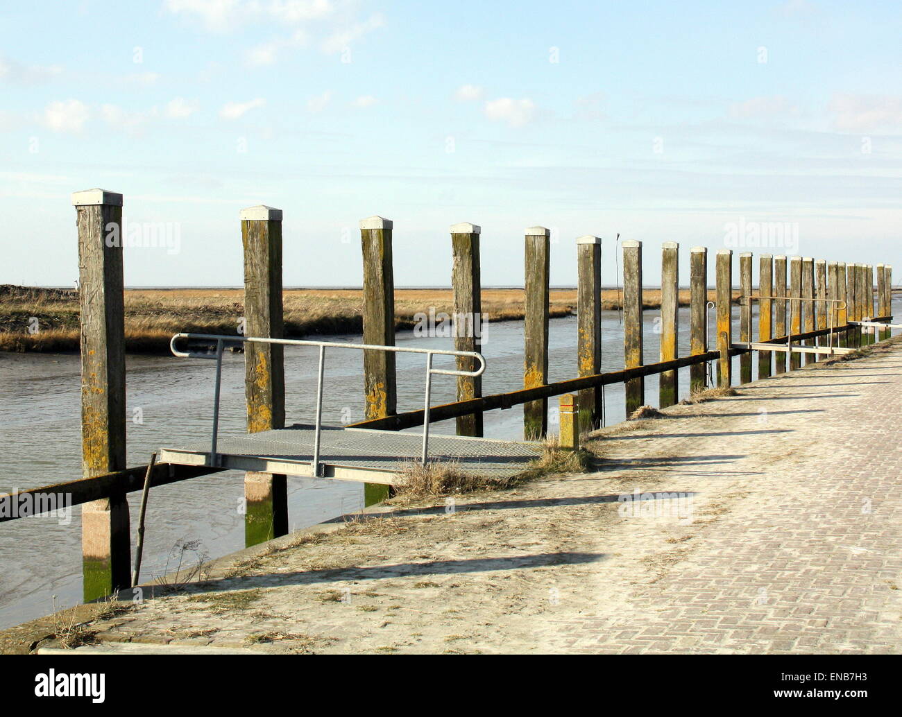 Wooden poles in the port of Noordpolderzijl. Netherlands Stock Photo