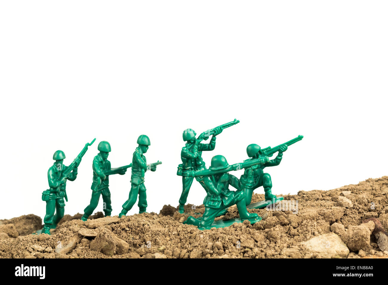 Toy soldiers march along the horizon in war image Stock Photo