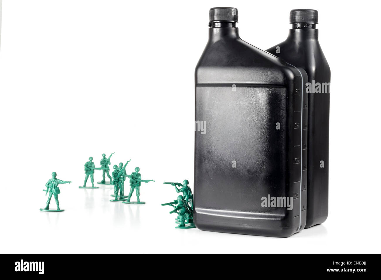 Toy army men with quart of oil symbolizing oil war in Middle East Stock Photo