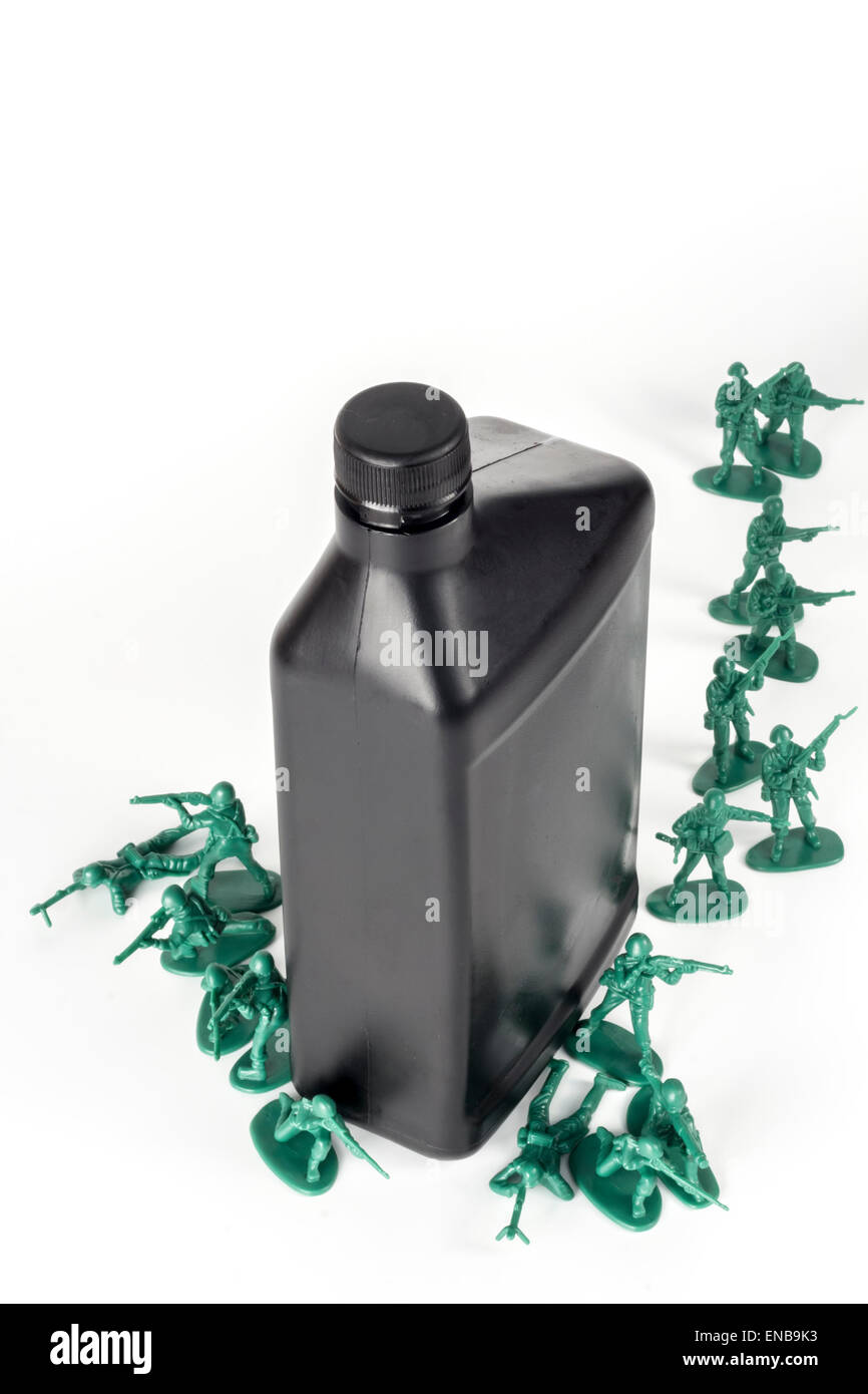 Toy army men with quart of oil symbolizing oil war in Middle East Stock Photo