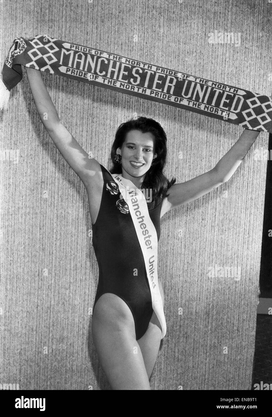 Hayley Worral aged 20 of Warrington, the new Miss Manchester United, holds up a club scarf after being selected at a gala black tie charity dinner at Old Trafford. The money raised will go to Liverpool's Hillsborough relief fund. April 1989. Stock Photo
