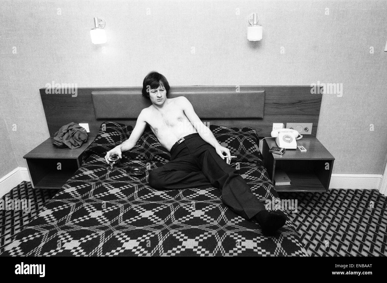 Snooker player Alex 'Hurricane' Higgins relaxing with a drink and a ...