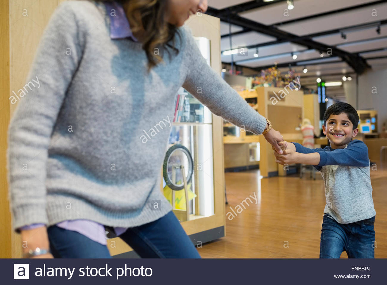 Pulling his arm hires stock photography and images Alamy