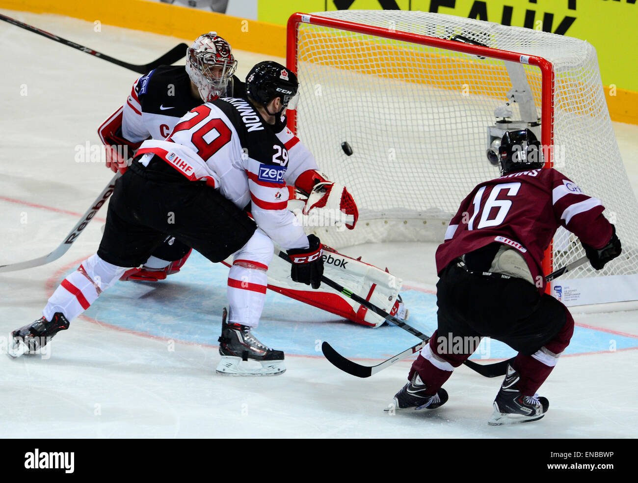 Kaspars Daugavins, of Latvia, right, shoots to score past Canada's