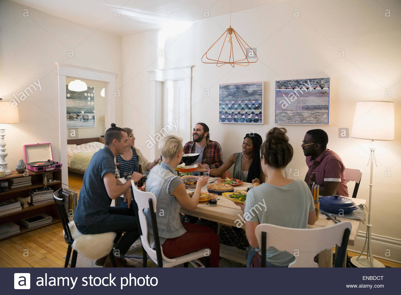 Friends enjoying dinner party at dining table Stock Photo - Alamy