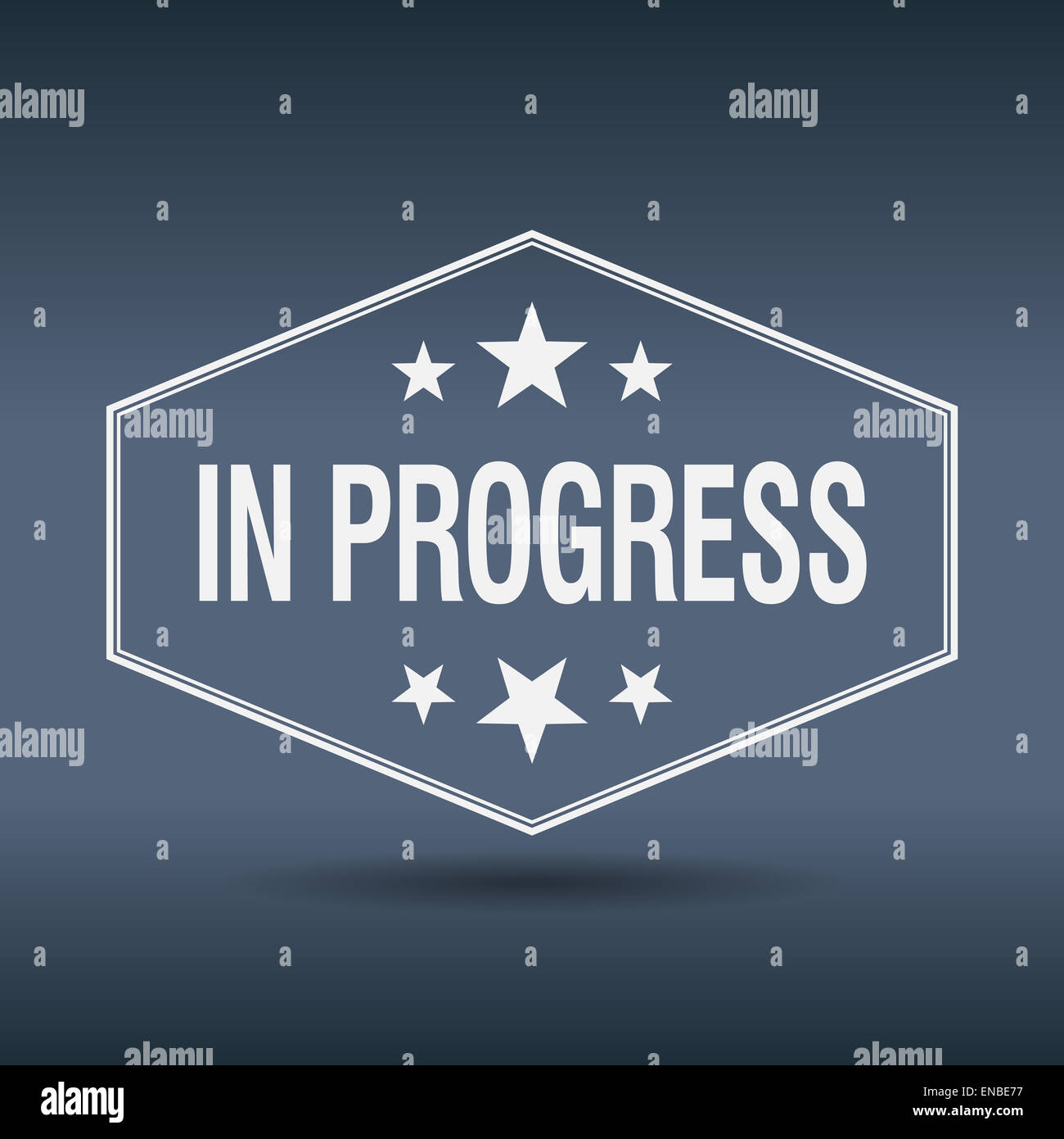 Inprogress Label in progress hexagonal white vintage retro style label Stock Photo - Alamy