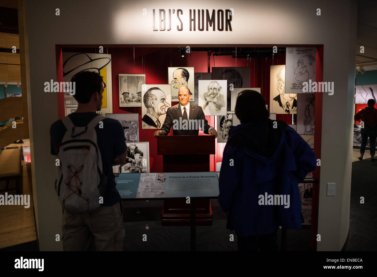 LBJ Library Animatronic Humor Exhibit Austin Texas | AUSTIN, Texas, United States — The "LBJ's Humor" exhibit at the LBJ Library and Museum features an animatronic figure of Lyndon Johnson at a lectern, surrounded by period editorial cartoons under the panel heading "Politics Is a Funny Business." Johnson was an avid collector of political cartoons lampooning himself, a trait that reflected his belief that a president who could not laugh at caricature could not survive Washington's brutal political culture. Stock Photo