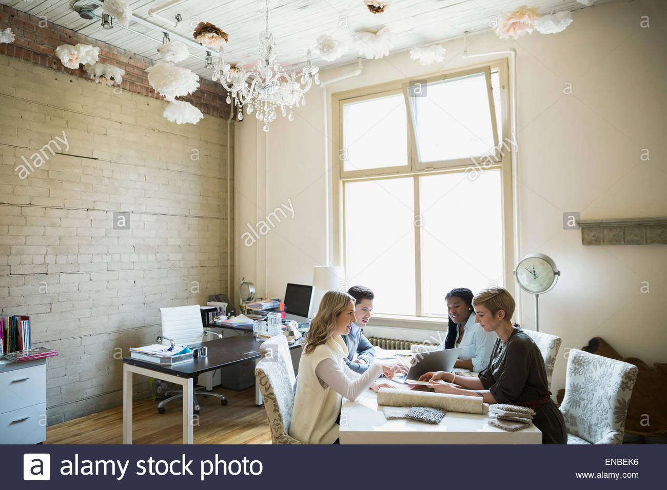 Interior designers presenting to couple in office Stock Photo